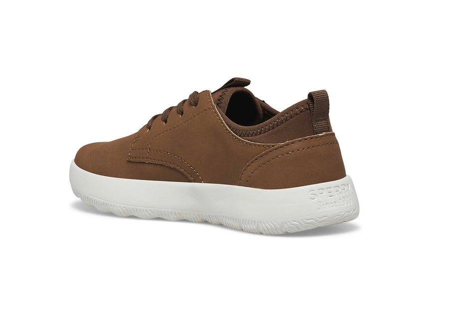 a brown sneaker with a white sole