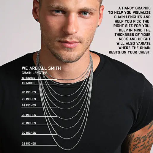 a man wearing a black t - shirt and a chain necklace