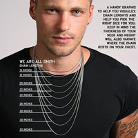 a man wearing a black t - shirt and a chain necklace