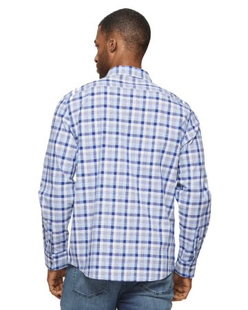 a man wearing a blue and white checkered shirt