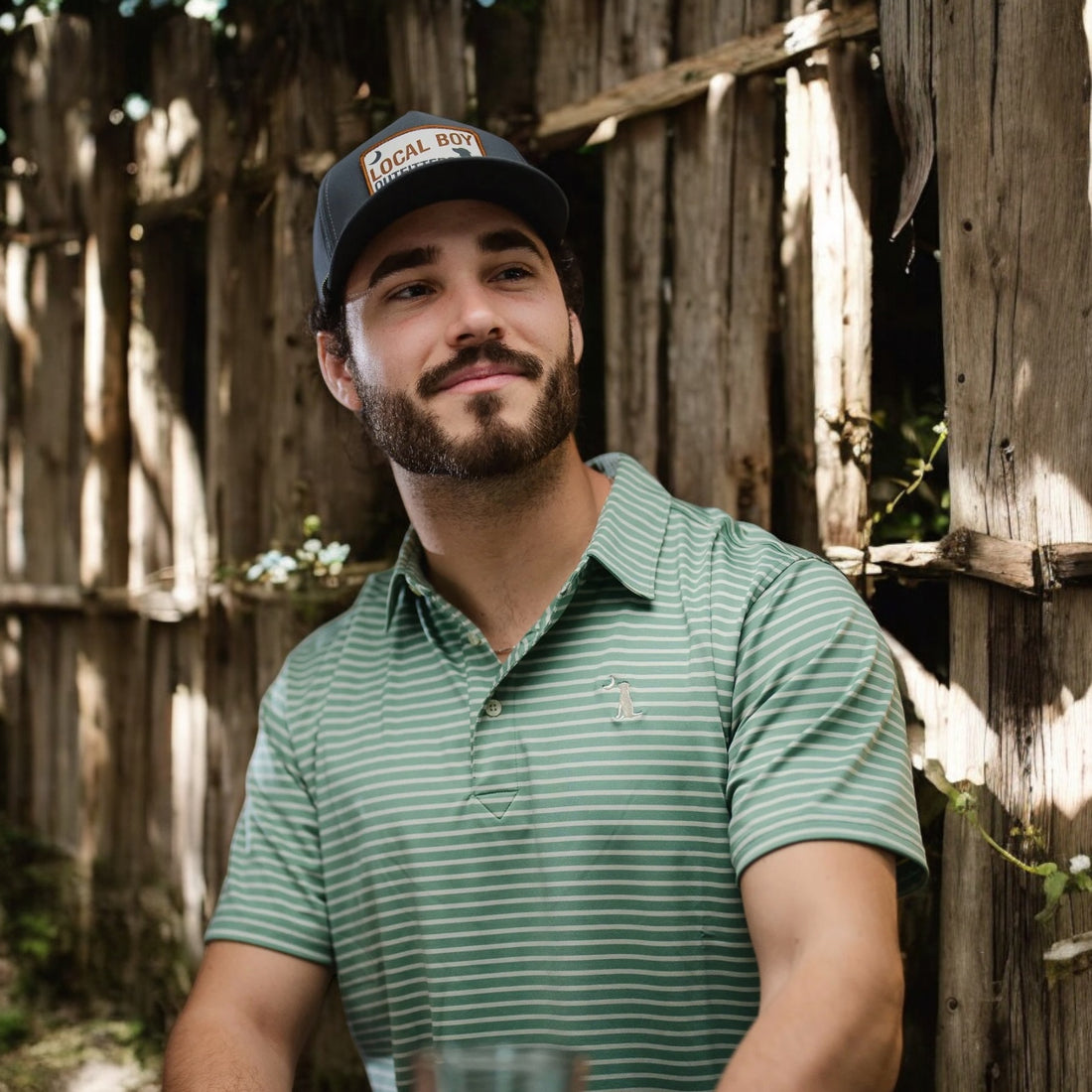 a man with a beard wearing a hat