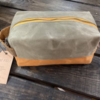 a bag sitting on top of a wooden bench